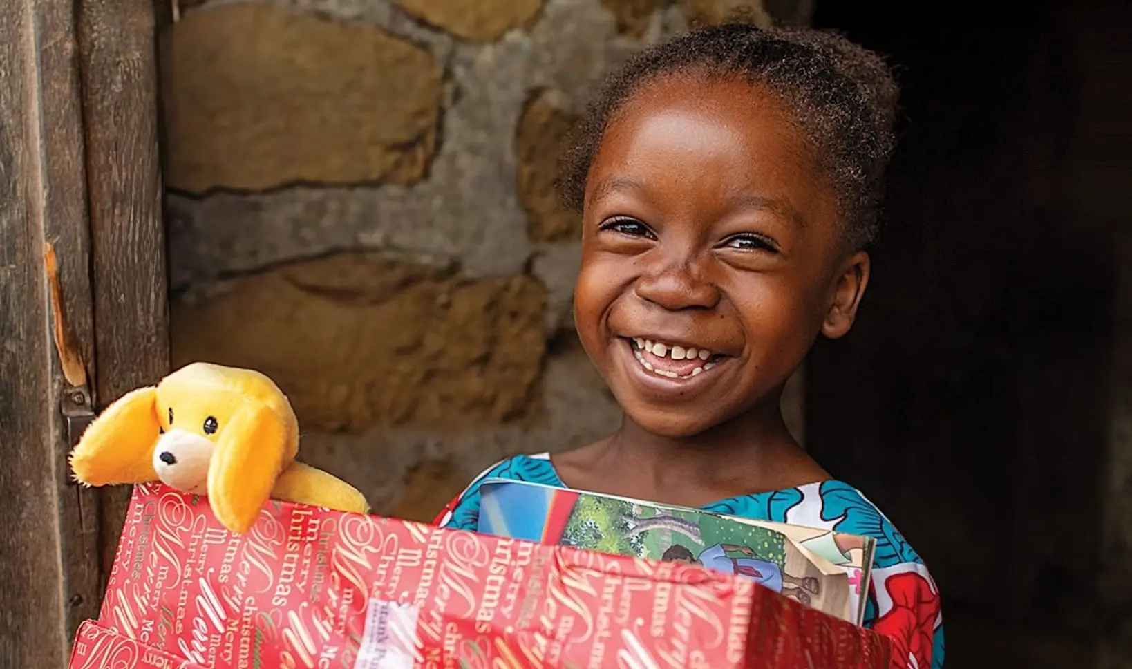 Children opening gifts during the Christmas season
